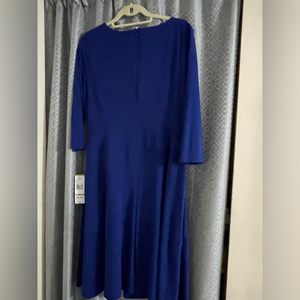 NEW with tags very nice soft dress with zipper on the back